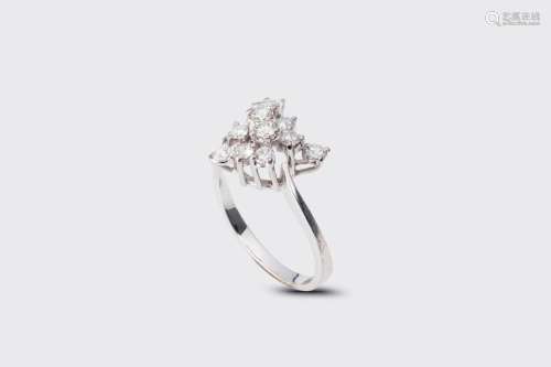 An 18 carat white gold ring set with eleven diamonds, 20th C...