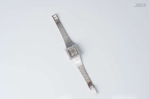 An 18 carat white gold Le Monde wristwatch set with 64 diamo...