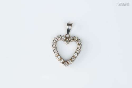 An 18 carat white gold heart-shaped pendant set with eightee...