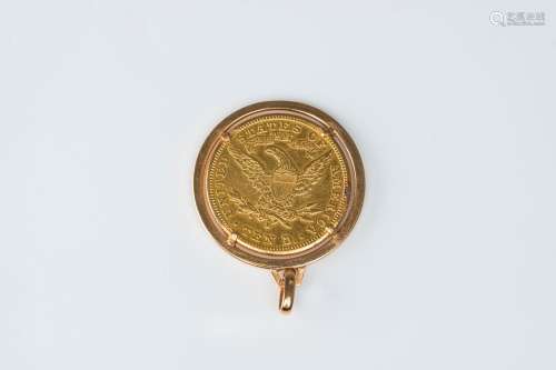 An 18 carat yellow gold pendant set with a 1901 American ten...