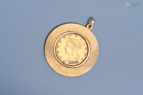 An 18 carat yellow gold pendant set with an 1893 21,6 carat ...