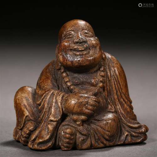 A Chinese Carved Aloeswood Budai