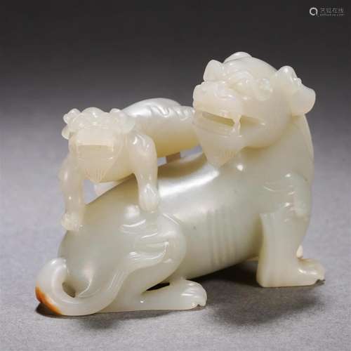 A Chinese Carved White Jade Mythical Beast Group