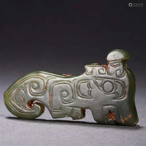 A Chinese Archaic Carved Jasper Dragon