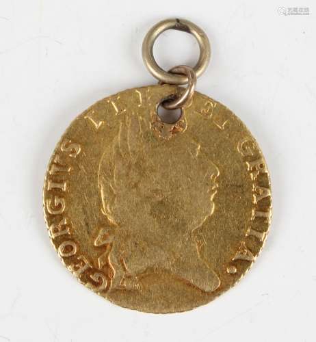 A George III half-guinea, mounted.