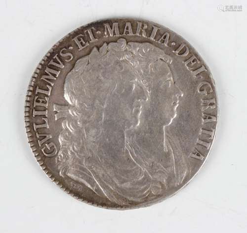 A William and Mary half-crown 1689, edge detailed 'Primo'.