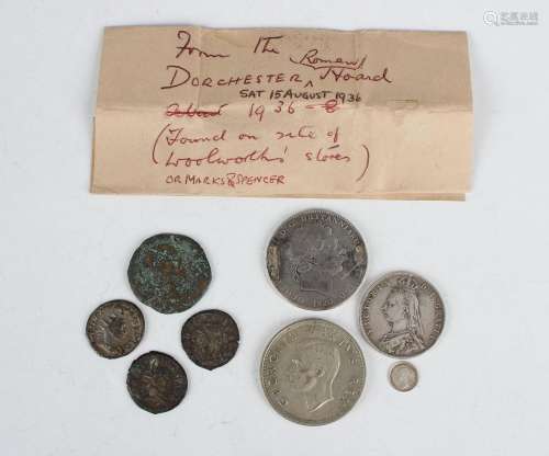 A small collection of British and world coins and banknotes,...