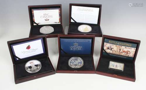 A group of five five-ounce silver commemorative coins and in...