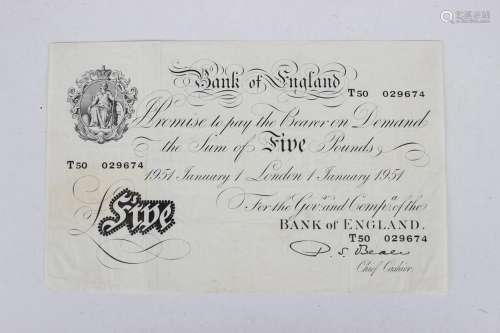 A Bank of England white five pounds note, P.S. Beale Chief C...