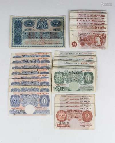 A collection of British banknotes, including a group of gree...