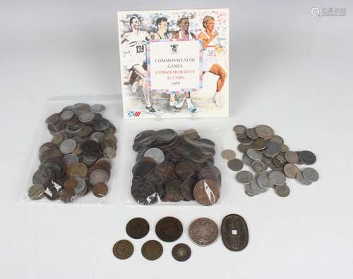 A collection of British and world coins and tokens, includin...