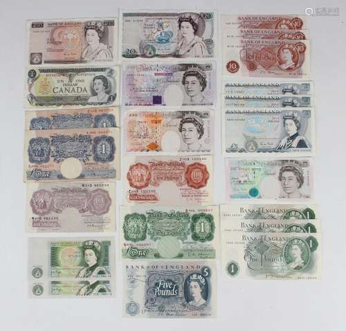 A collection of Bank of England banknotes, including a twent...