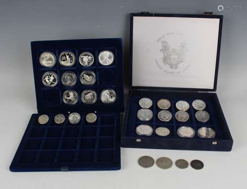 A collection of twenty-four USA silver one dollar coins, inc...