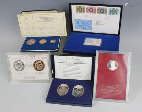 A small group of various silver commemorative coins and meda...