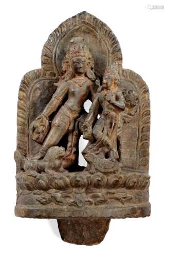 SHIVA ET PARVATI.Népal, 17e siècle. H 23 cm.Pierre et restes...