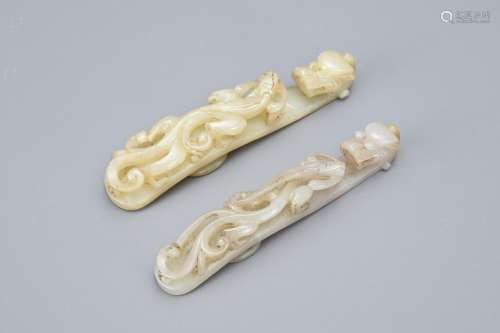 TWO CHINESE GREY AND PALE CELADON JADE BELT BUCKLES