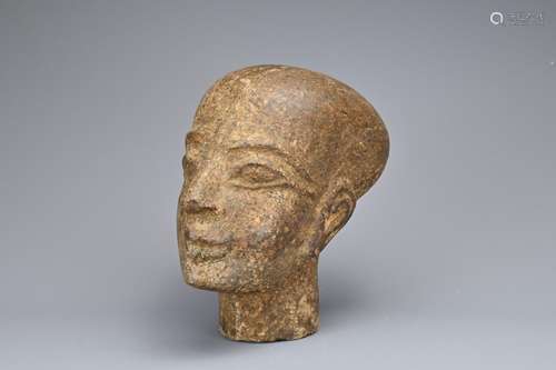 AN EGYPTIAN STONE HEAD OF FEMALE