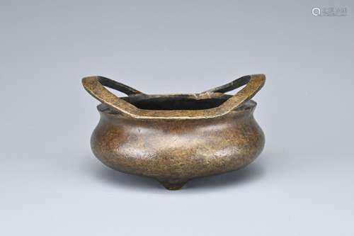 A CHINESE BRONZE TRIPOD CENSER