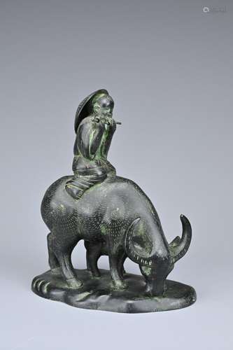 A CHINESE BRONZE MODEL OF BOY ON BUFFALO