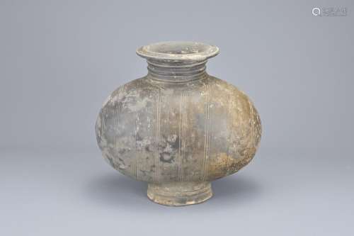 A CHINESE BURNISHED AND INCISED POTTERY COCOON JAR, HAN DYNA...
