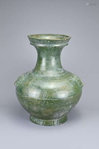 A LARGE CHINESE GREEN GLAZED POTTERY HU JAR WITH TAOTIE MASK...