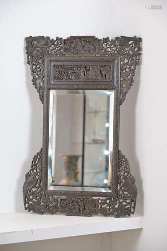 A CHINESE HEAVILY CARVED WOOD FRAMED MIRROR, EARLY 20TH CENT...