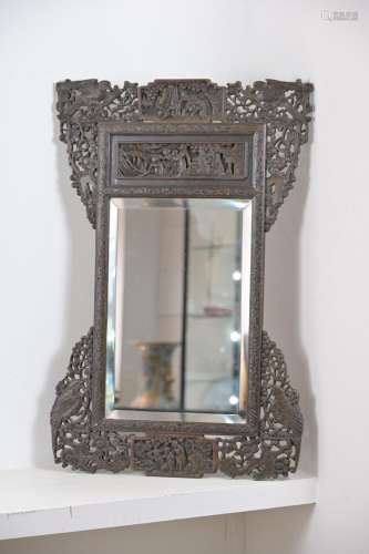 A CHINESE HEAVILY CARVED WOOD FRAMED MIRROR, EARLY 20TH CENT...