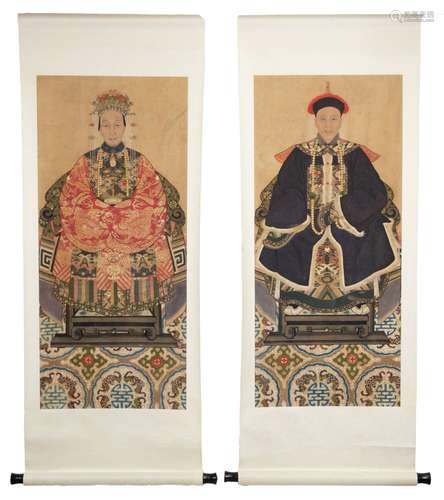 A PAIR OF CHINESE PAINTED ANCESTOR PORTRAITS ON PAPER MOUNTE...