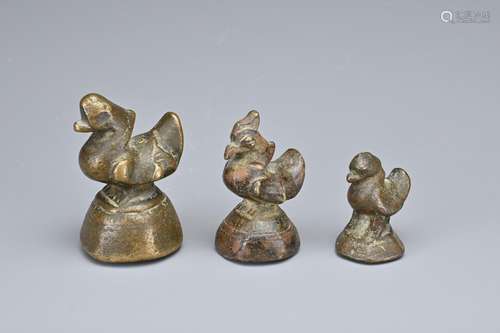 THREE BURMESE BRONZE OPIUM WEIGHTS, 19TH CENTURY OR EARLIER