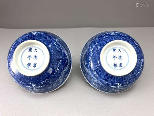 A Pair of Blue ground Dragon Bowls, Kangxi six character mar...