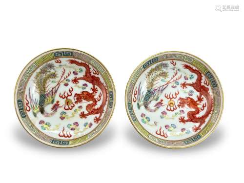 A Pair of Dragon and Phoenix Saucer Dishes, six character ir...