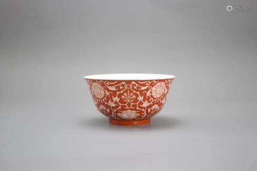 A Coral Ground Lotus Scroll Bowl, Qianlong six character und...