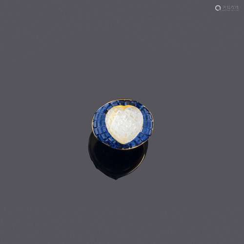 BAGUE EN CRISTAL DE ROCHE ET SAPHIR, SABBADINI.Or jaune 750,...