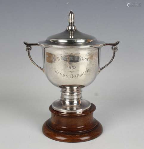 A George VI silver trophy cup and domed cover with ovoid fin...
