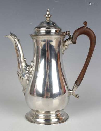 A George VI silver hot water pot of tapered low-bellied form...