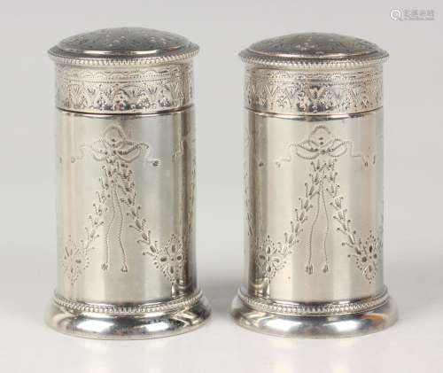 A pair of George V silver pepper casters, each cylindrical b...