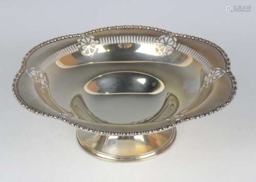 A George V silver circular bowl with pierced decoration with...