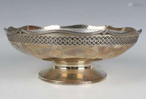A George V silver circular bowl, pierced with a lattice band...