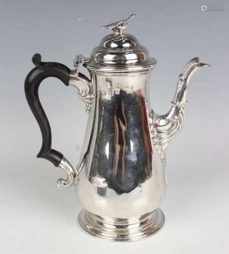 A George III silver coffee pot of baluster form, the domed h...