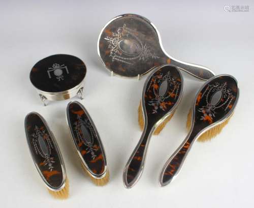 A George V silver and tortoiseshell mounted circular trinket...