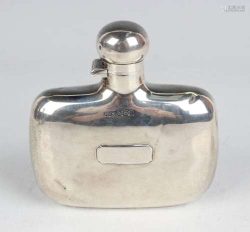 An Edwardian silver hip flask of curved oblong form with scr...