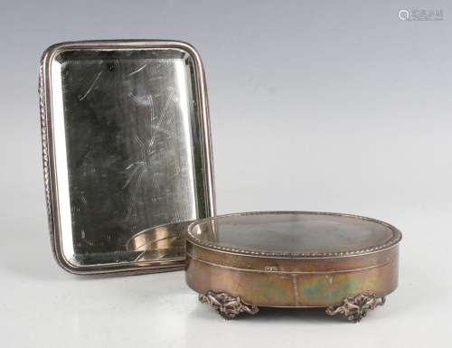 A George V silver oval jewellery box, the hinged lid with be...