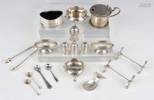 A small collection of assorted silver, including a cylindric...