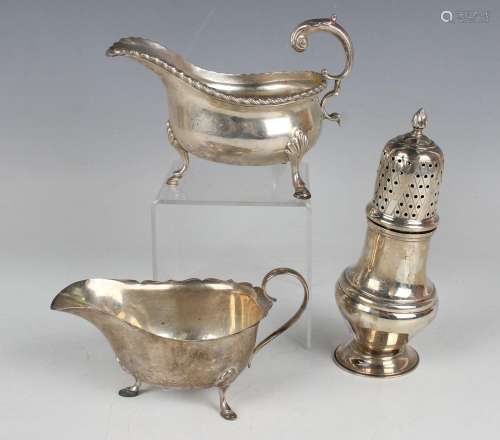 A George V silver sauceboat with flying scroll handle and ga...