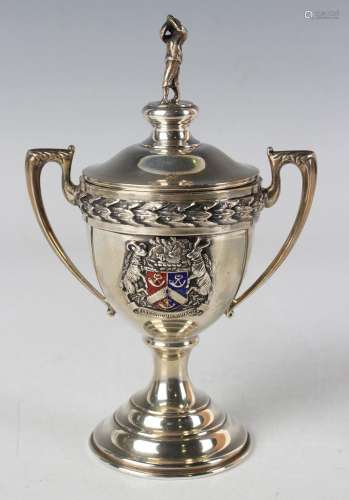 A George VI silver golf trophy cup and cover with golfer fin...