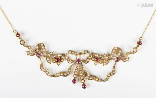 An Edwardian gold, ruby and half-pearl set necklace, the fro...