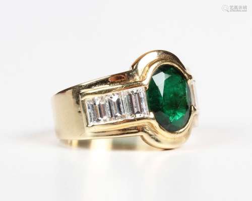 A gold, emerald and diamond ring, collet set with the oval c...