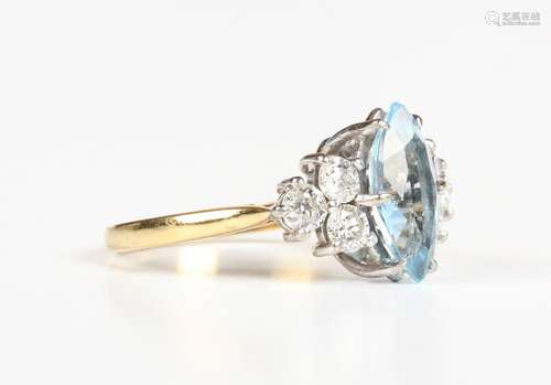 A gold, aquamarine and diamond ring, claw set with the marqu...