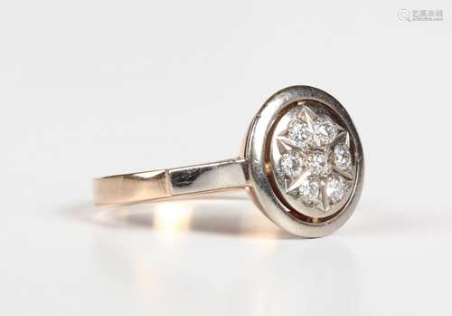 A Russian .583 gold and diamond circular cluster ring, mount...