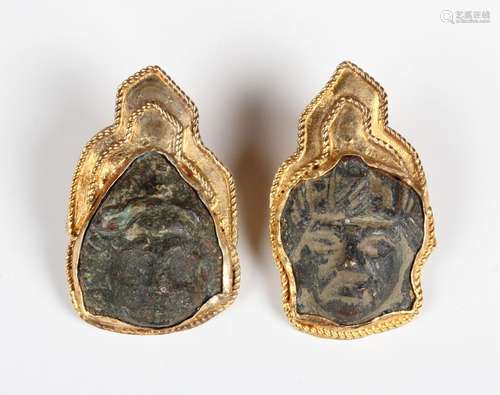 A pair of silver gilt mounted patinated bronze earrings, des...